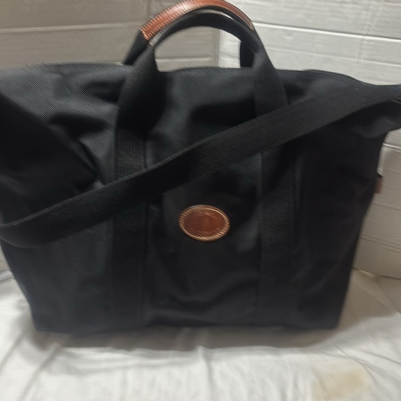 Longchamp large capacity nylon bag with one main compartment. Made in France.